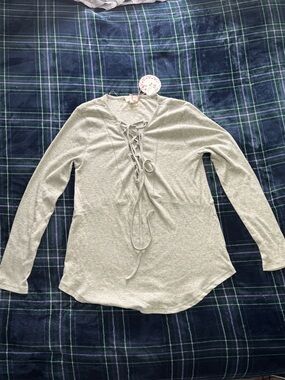 Umgee light grey flowy long sleeve top with lace up detail. Size: M